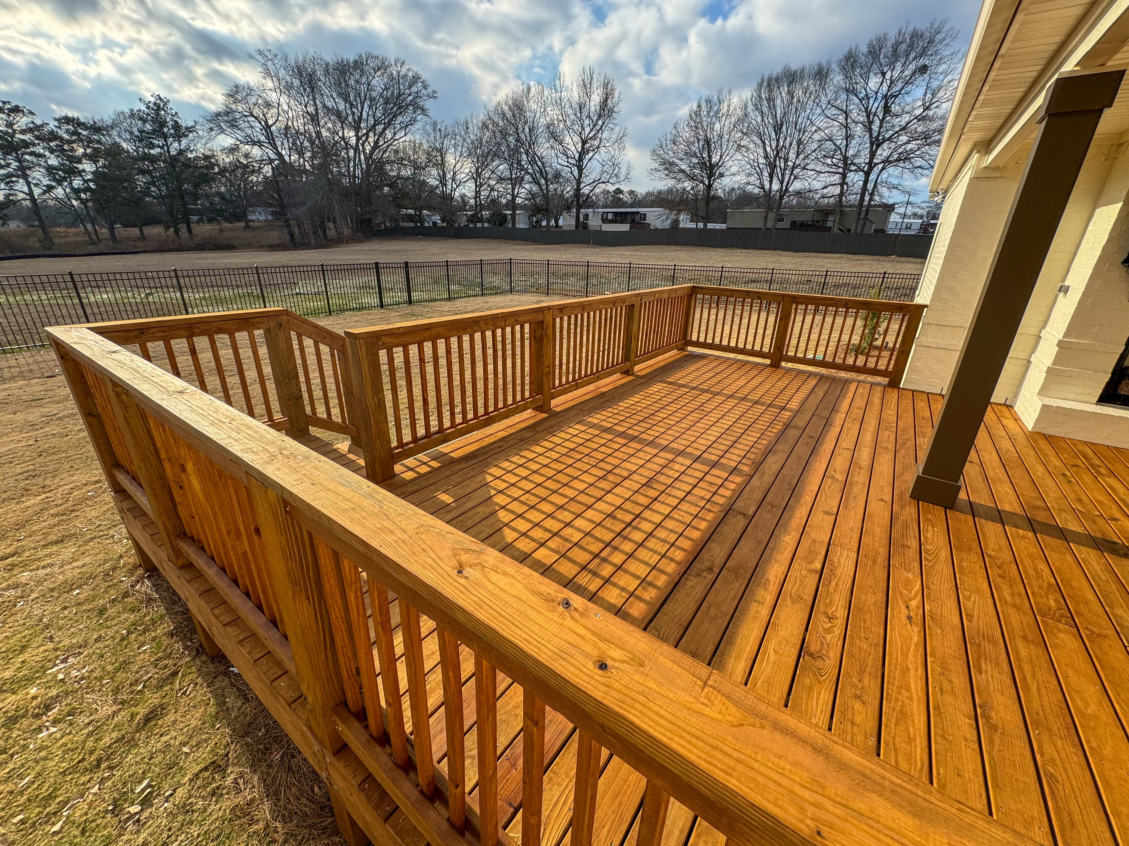 Stained deck with railing
