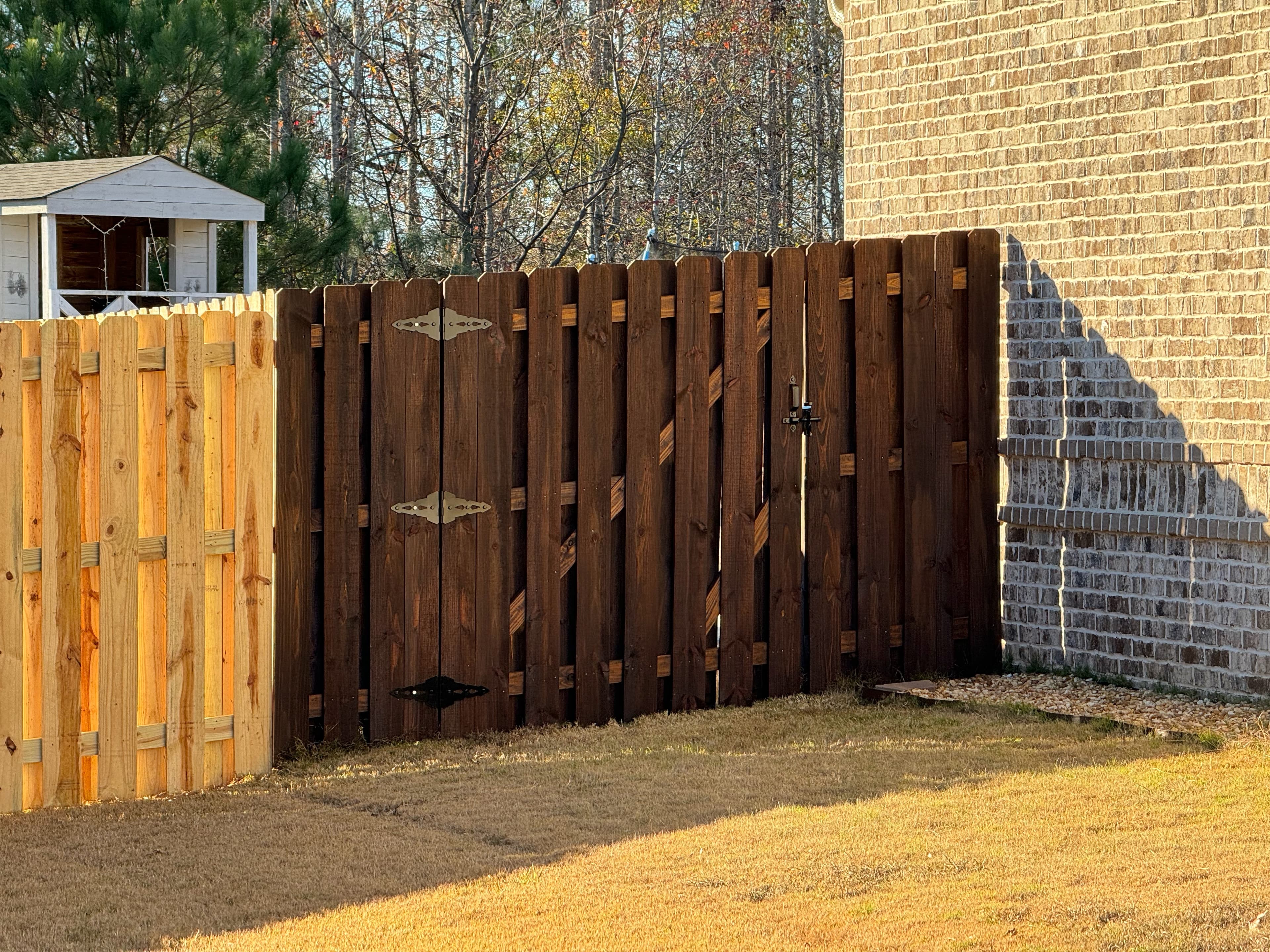 Stained fence before and after