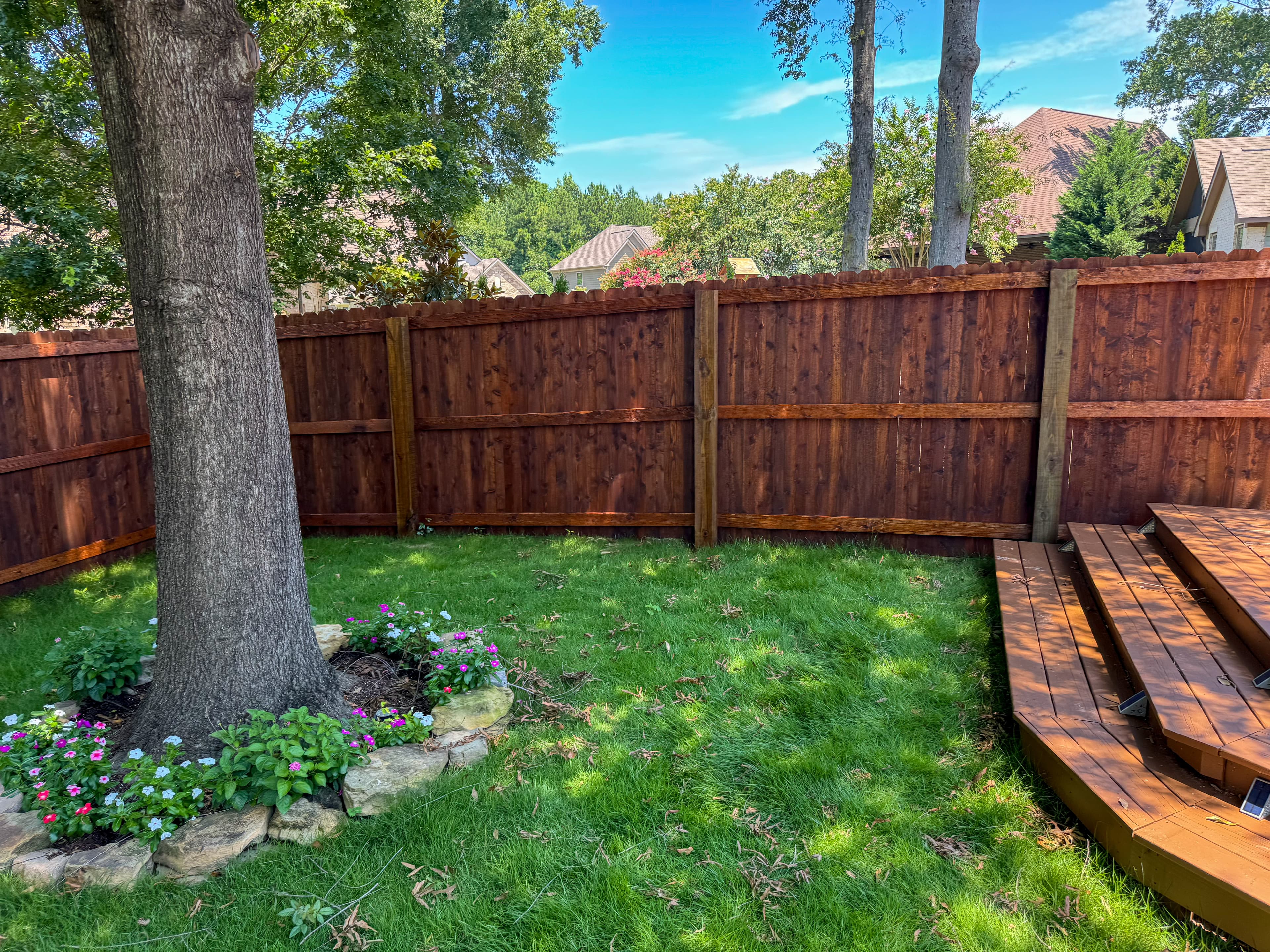 Stained privacy fence and deck