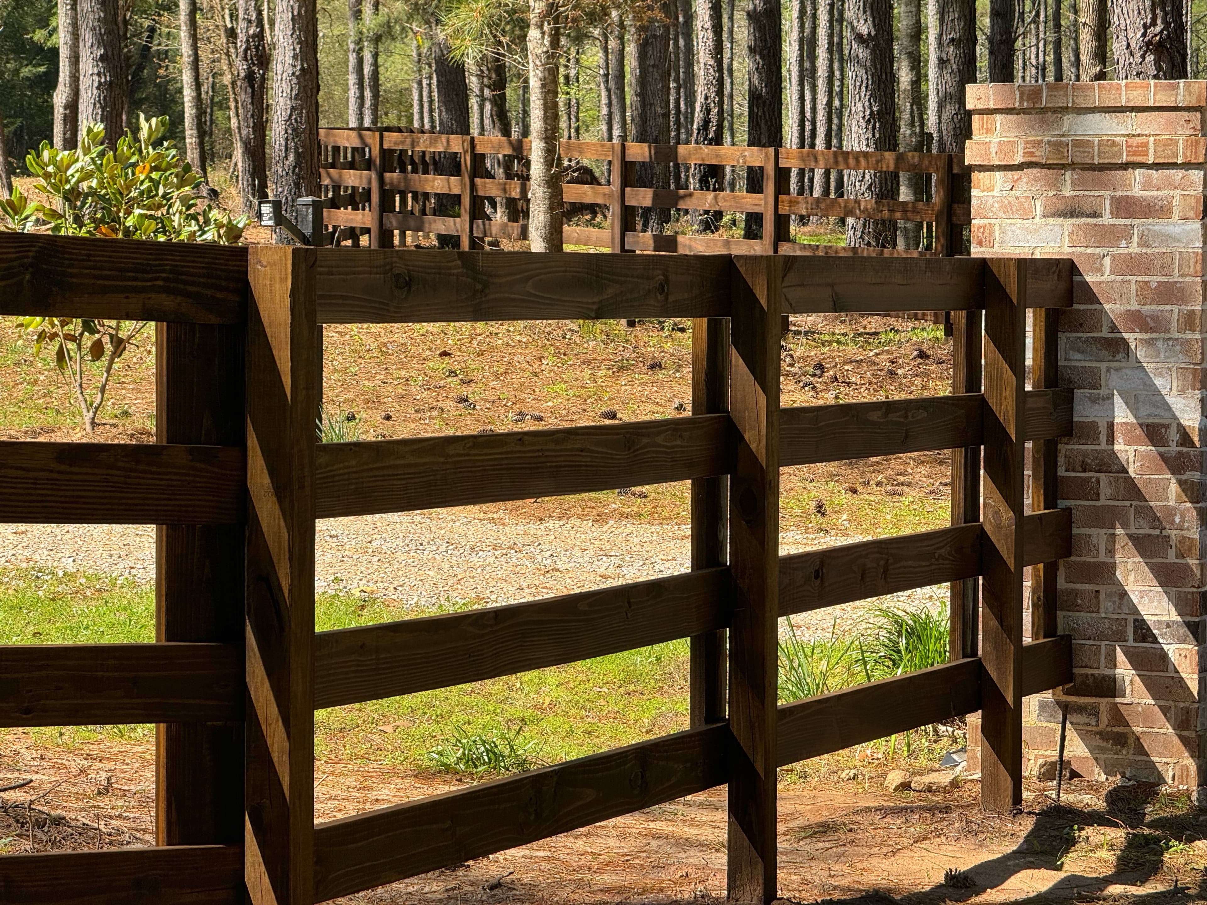 Professionally stained fence at an Auburn, Alabama home