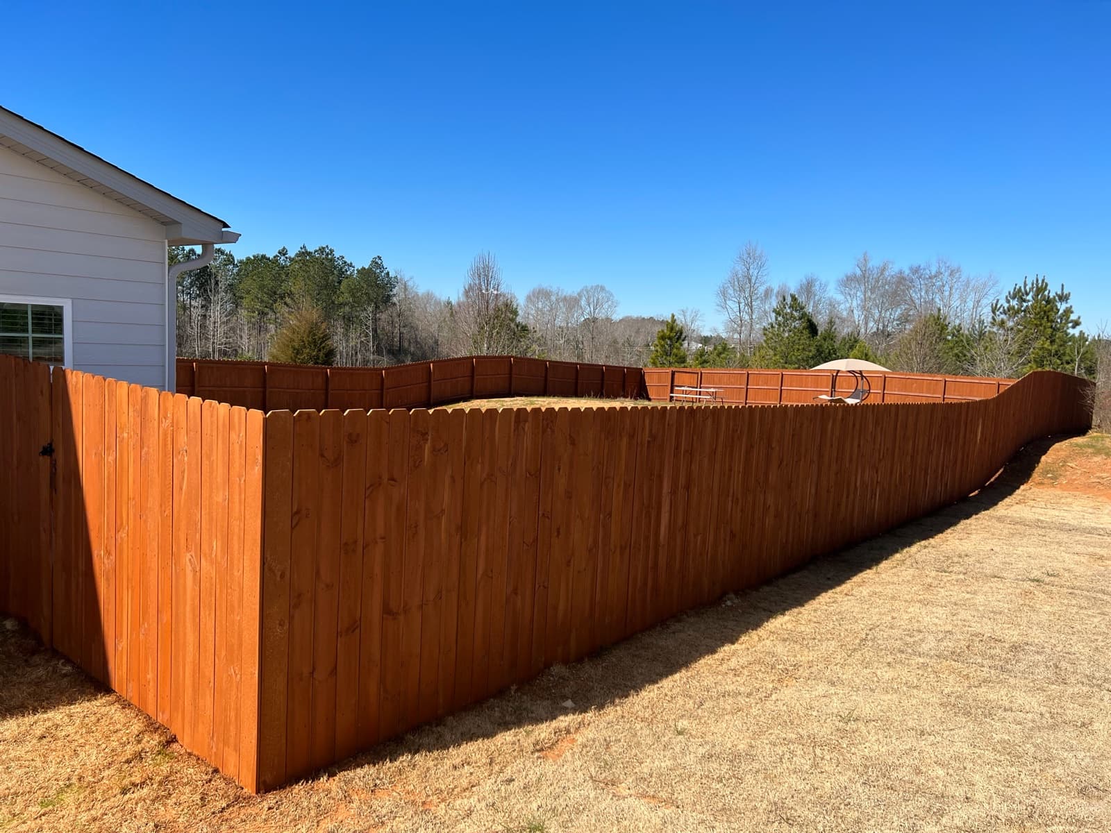 Fence line stained in Auburn