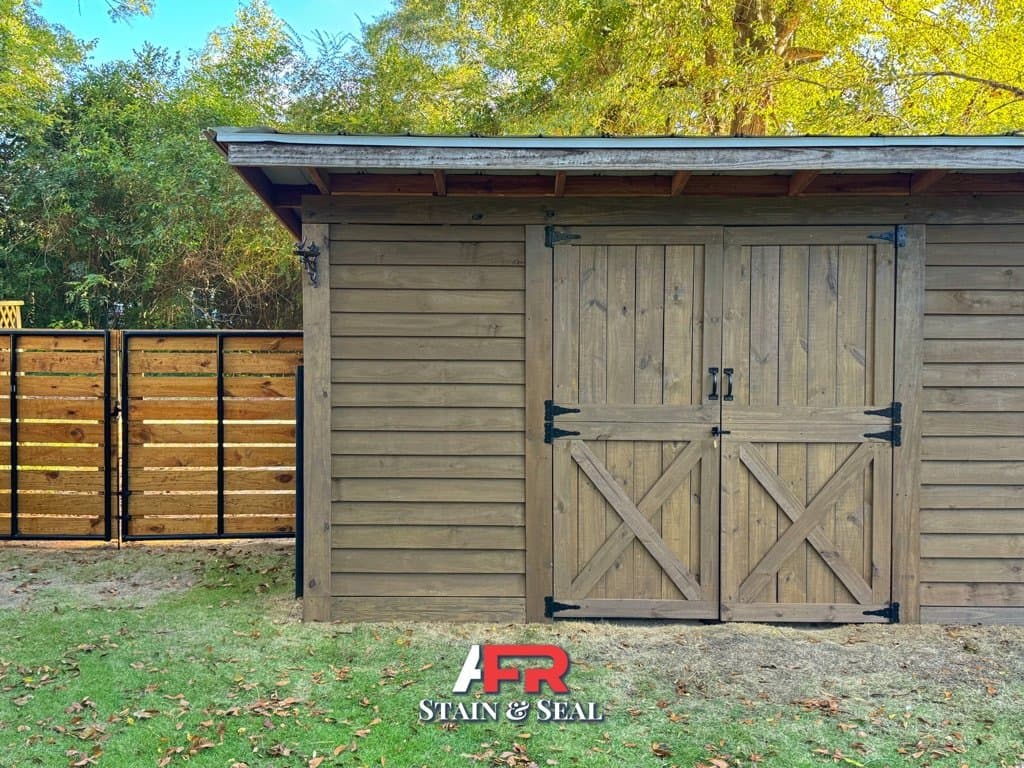 Shed doors and horizontal fence stained in Barnwood