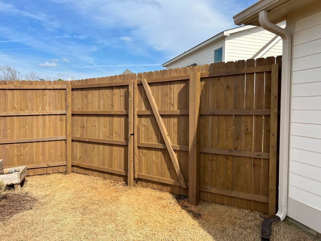 Fence and gate corner stained in Barnwood