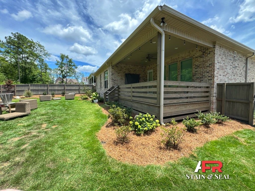 Covered porch and fence stained in Cape Cod
