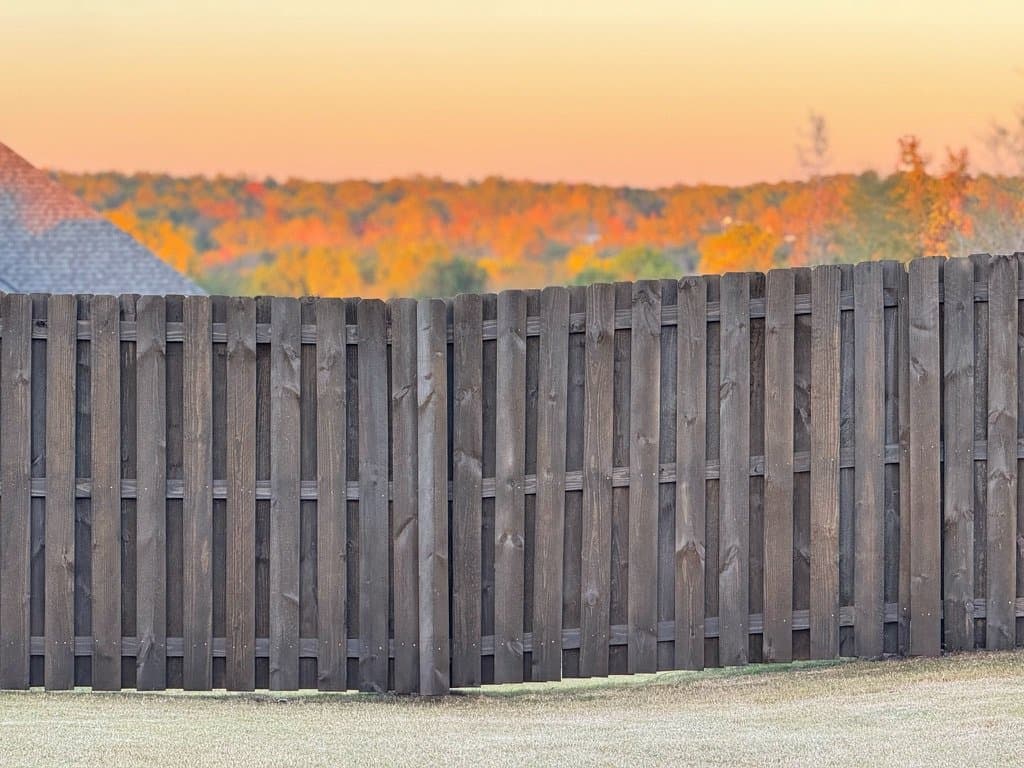 Shadowbox fence stained in Chocolate at sunset