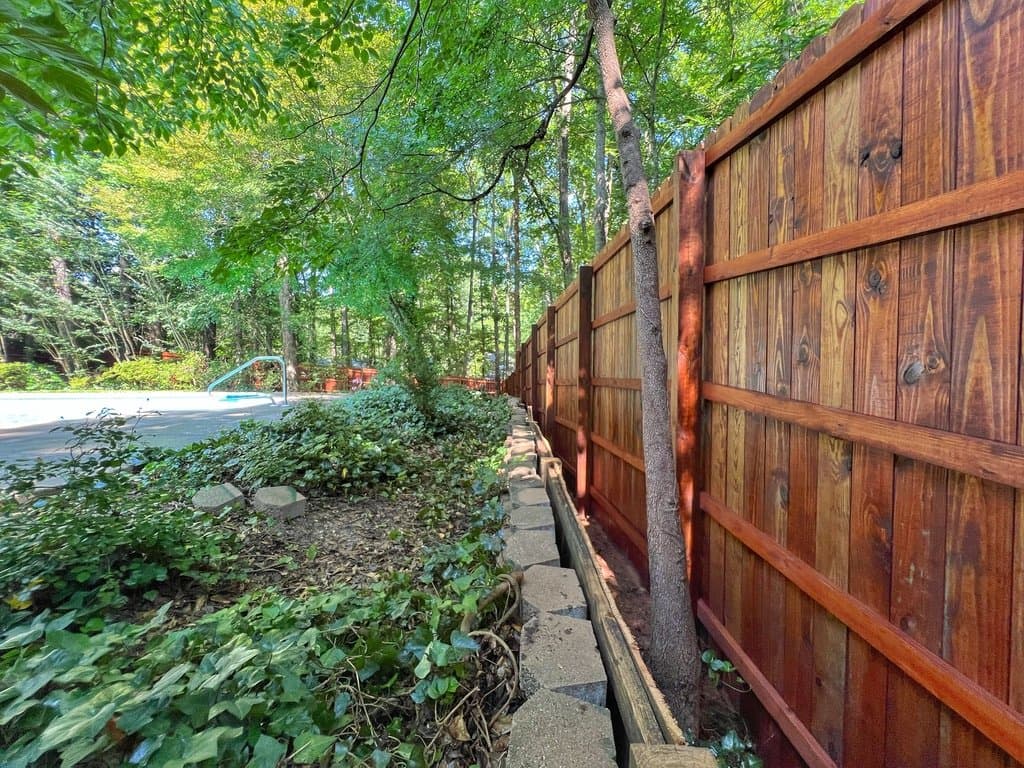 Fence line stained in Mahogany