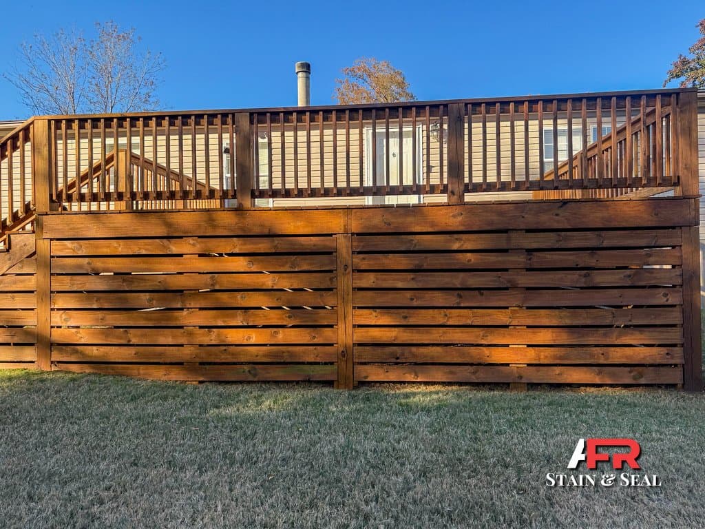 Deck with horizontal skirting stained in Pecan
