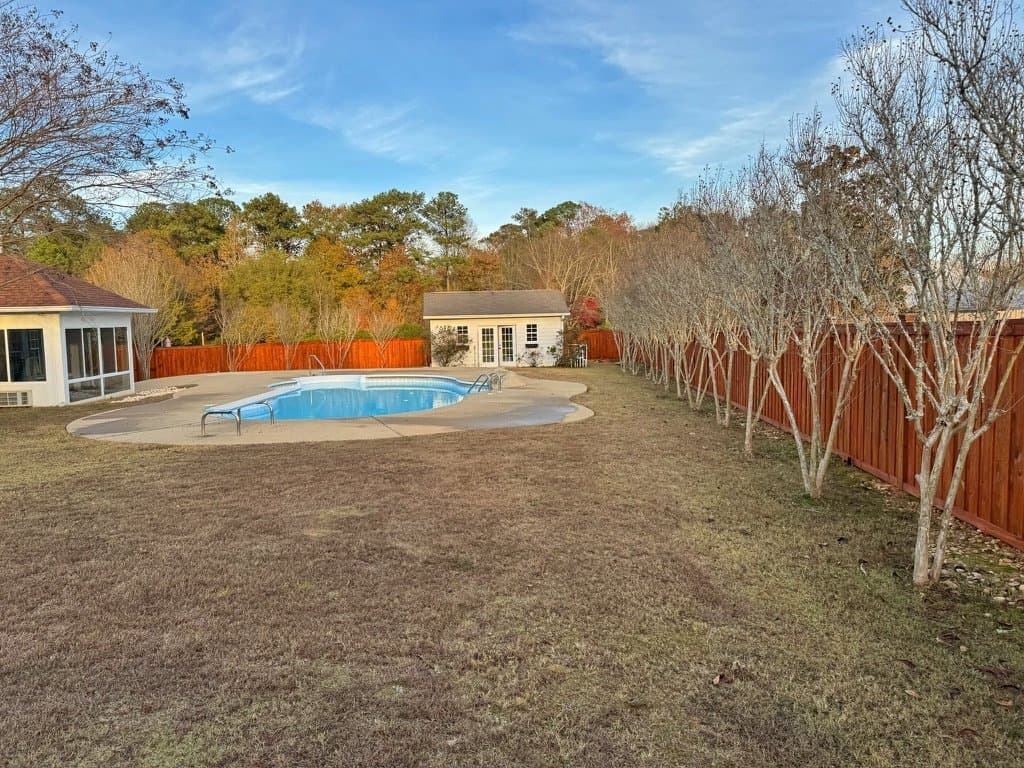 Poolside fence stained in Sequoia
