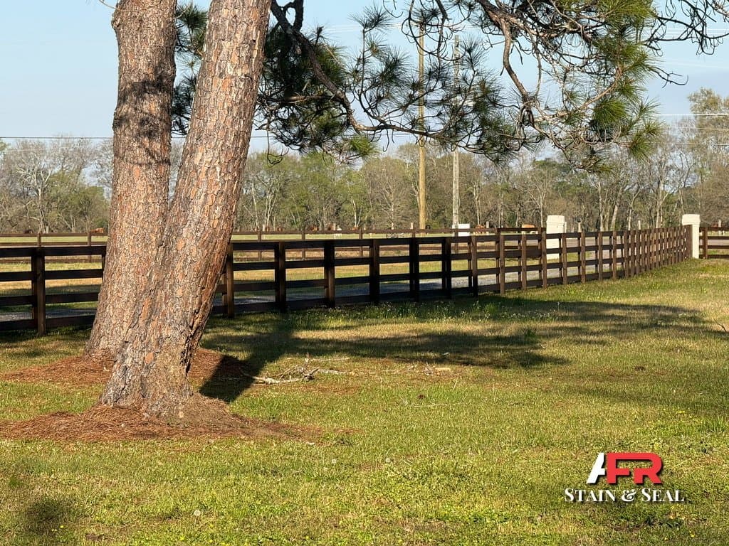 Ranch fence stained in Walnut