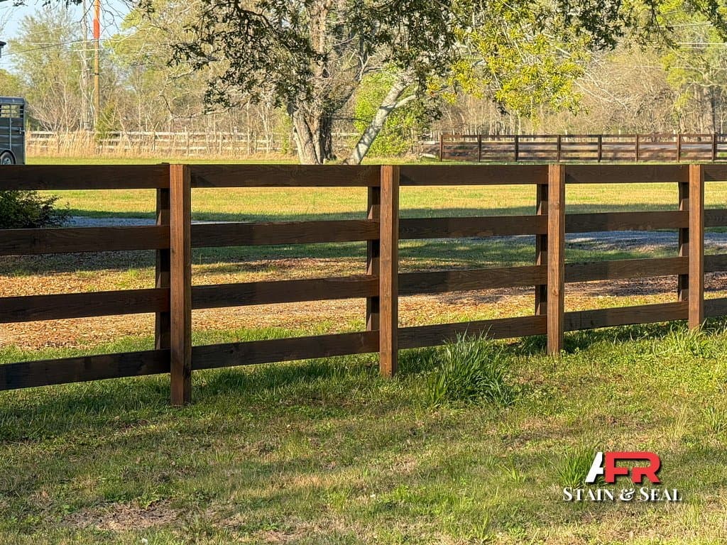 Ranch fence stained in Walnut